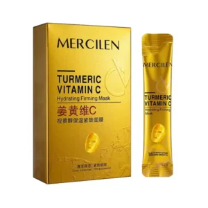 Kultainen Mercilen Turmeric Vitamin C Hydrating Firming Mask -tuotepakkaus ja sen vieressä oleva kapea kerta-annospussi valkoisella taustalla.