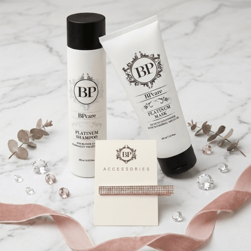 BPcare Platinum Shampoo ja Platinum Mask -tuotepakkaukset sekä strassikoristeinen hiusklipsi marmorialustalla vaaleanpunaisen silkkisomisteen ja koristekivien ympäröimänä.