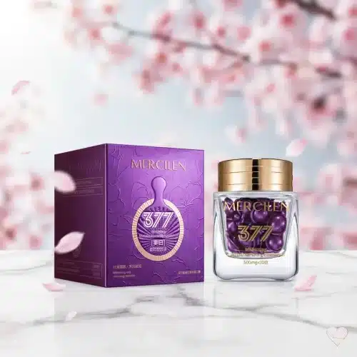 Purppura kultakantinen Mercilen-kasvoöljypurkki, joka on täynnä öljykapseleita, ja kukkakuvioitu purppura pakkaus.