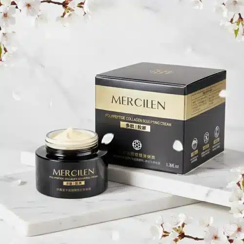 Tummanharmaa ja kultainen Mercilen Polypeptide Collagen -kasvovoidepurkki sekä tyylikäs mustakultainen pakkaus.